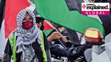 A demonstrator wearing a Palestinian Keffiyeh, as people protest Israel's attacks on Hezbollah targets in Lebanon, in Los Angeles, California, U.S., September 24, 2024.