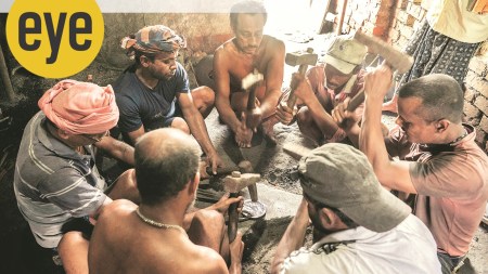 Artisans hammering on ingots