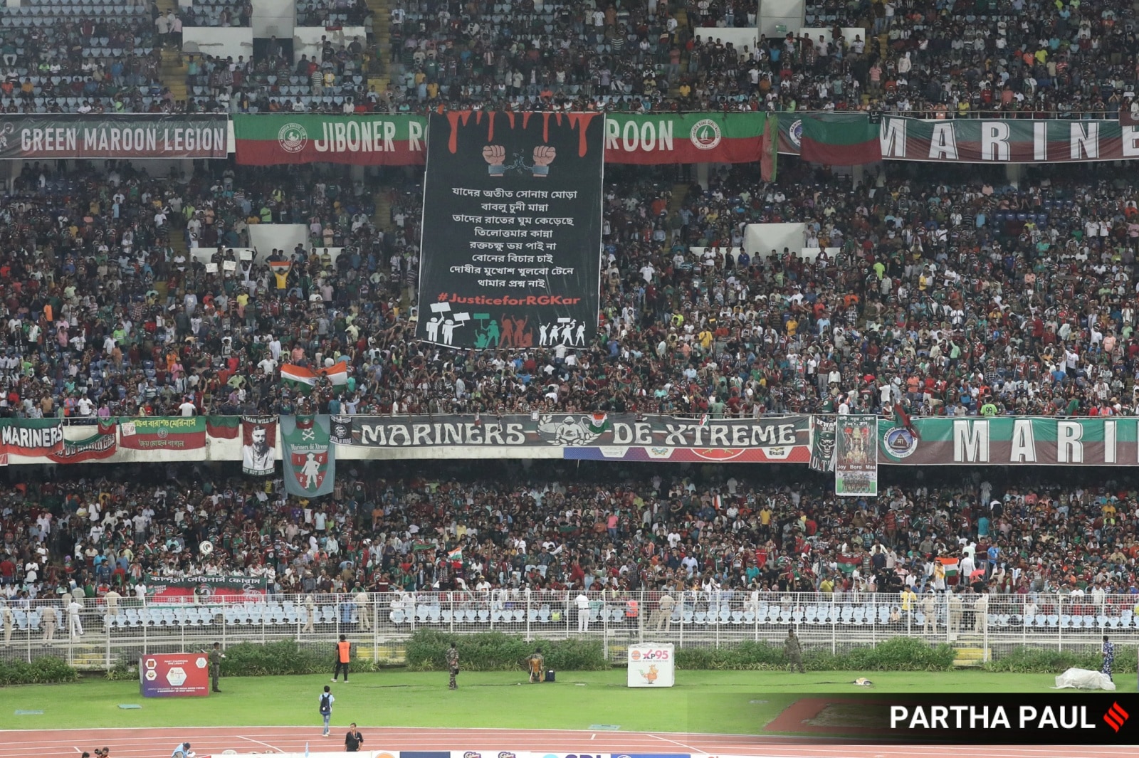 Football fans display a tifo at Salt Lake Stadium to protest against the alleged rape and murder of  a  junior  doctor at    RG Kar MCH during the Durand Cup final match  between North East United  FC  and  Mohunbagan Super giant .Express photo by Partha Paul. 