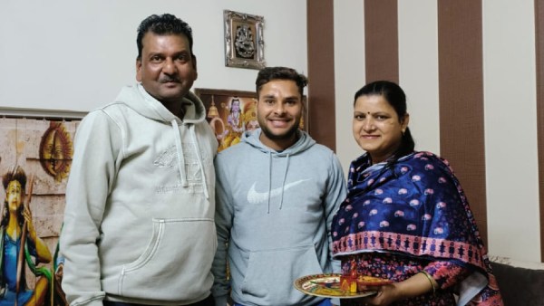 Mohammad Amaan with his coach Rajeev Goyal at their residence. (Special Arrangement)