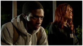 Caleb McLaughlin and Andra Day in a still from The Deliverance.