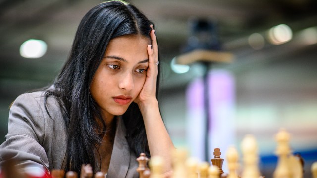 Divya Deshmukh, who defeated women’s international master Sofiia Hryzlova in the third round at the Chess Olympiad, has a long think about her next move. (PHOTO: FIDE / Michal Walusza)