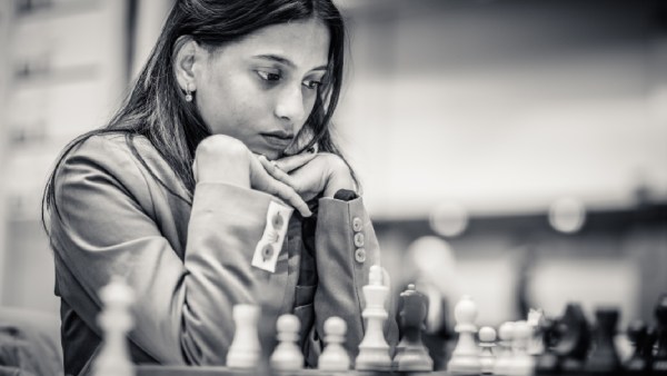 Divya Deshmukh contemplates her next move at the Chess Olympiad. (PHOTO: FIDE/Michal Walusza)