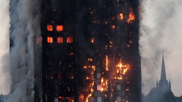 The Grenfell Tower residential building is seen on fire in London