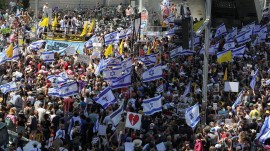 Protesters rally against the government and to show support for the hostages who were kidnapped during the deadly October 7 attack, in Tel Aviv