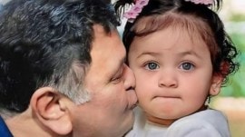 The image, reportedly generated by AI, shows Rishi Kapoor planting a tender kiss on the cheek of his adorable granddaughter Raha Kapoor, the daughter of actors Ranbir Kapoor and Alia Bhatt.