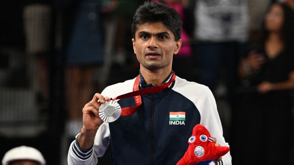 Silver medallist Suhas Lalinakere Yathiraj of India celebrates on the podium