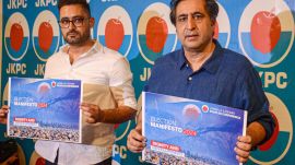 Srinagar: Jammu and Kashmir People's Conference Chairman Sajad Lone along with party chief spokesperson releases the party manifesto ahead of the state assembly elections, in Srinagar, Thursday, Sept. 5, 2024.