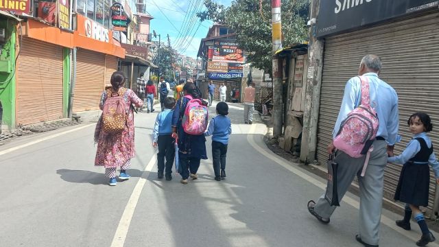 A woman leaving with her daughter and nieces. (Express photo by Saurabh Parashar)