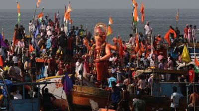 The famous Lalbaug Cha Raja immersion on Wednesday morning at Girgaon Chowpatty. (Express Photo by Amit Chakravarty)