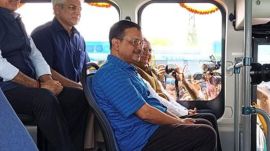 Kejriwal photos on DTC bus
