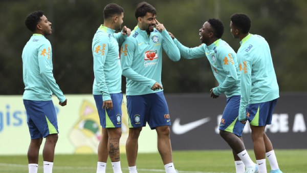 Brazil's Vinicius Jr, second from right, pokes fun at Lucas Paqueta, during a training session ahead of a World Cup qualifier against Ecuador, in Curitiba, Parana state, Brazil,