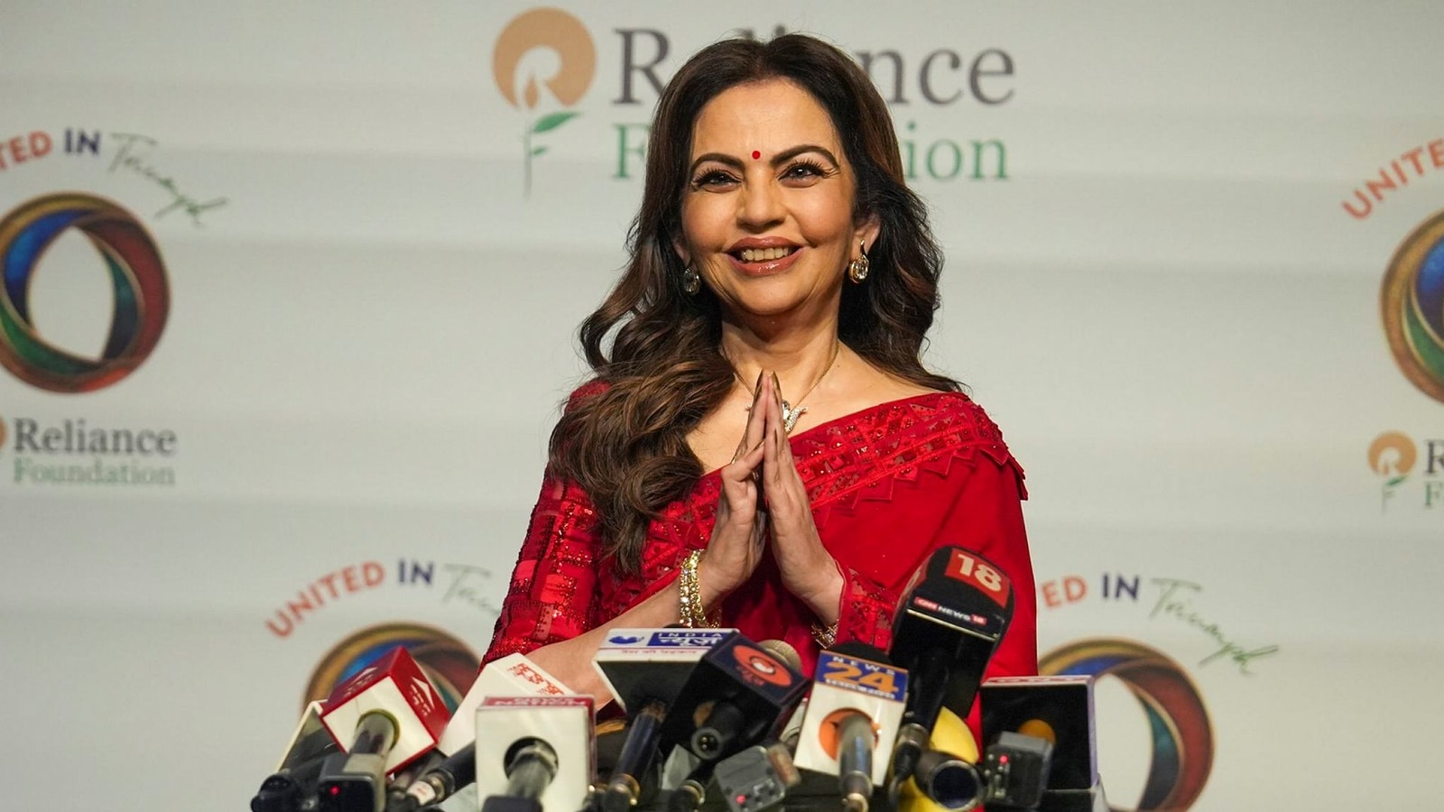 Nita Ambani channels retro Bollywood vibes in red sari, statement gold necklace for athlete dinner at Antilia