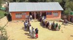 Voters stand in queues to cast votes at a polling station during the first phase of Jammu and Kashmir Assembly elections, in Kulgam district,