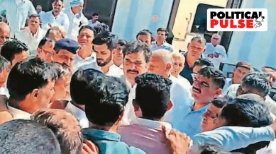 BJP leaders Kuldeep and Bhavya Bishnoi with a group of villagers in their constituency Adampur