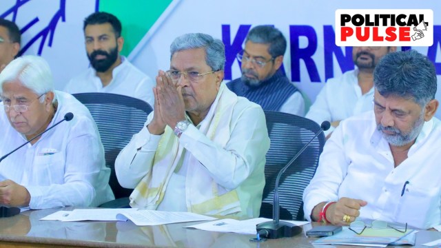 Karnataka CM Siddaramaiah (centre) with his deputy D K Shivakumar. (R)