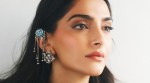 Sonam Kapoor stuns in a gothic-inspired Dior ensemble at Paris Fashion Week.