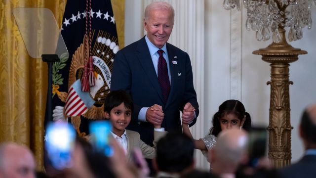 President Joe Biden holds the hands of Soren, left, and Zara, right, the children of Rep. Ro Khanna, D-Calif., astatine  a reception celebrating Diwali, successful  the East Room of the White House successful  Washington, Monday, Oct. 28, 2024. (AP Photo/Ben Curtis)