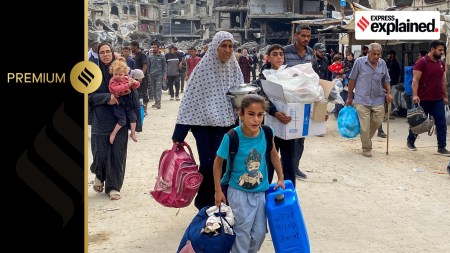 Displaced Palestinians make their way as they flee areas in northern Gaza Strip following an Israeli evacuation order, amid the Israel-Hamas conflict, in Jabalia, October 6, 2024.