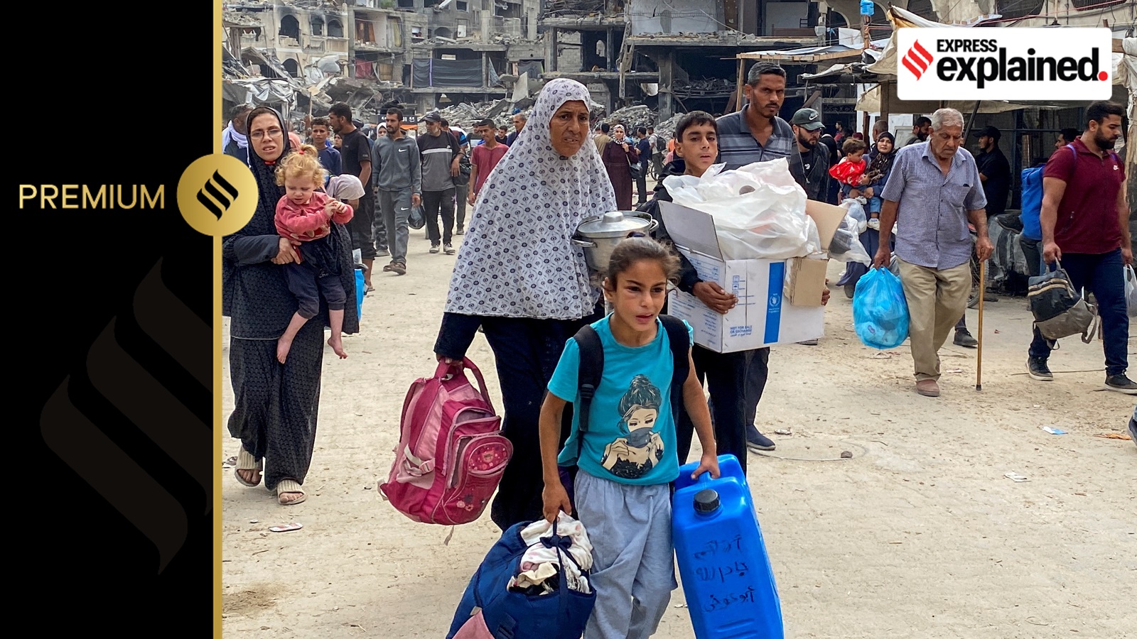 Displaced Palestinians make their way as they flee areas in northern Gaza Strip following an Israeli evacuation order, amid the Israel-Hamas conflict, in Jabalia, October 6, 2024.