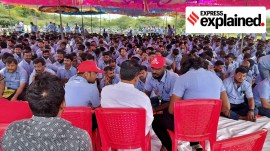 Workers of a Samsung facility speak with their union leader E. Muthukumar during a strike to demand higher wages at its Sriperumbudur plant near Chennai.
