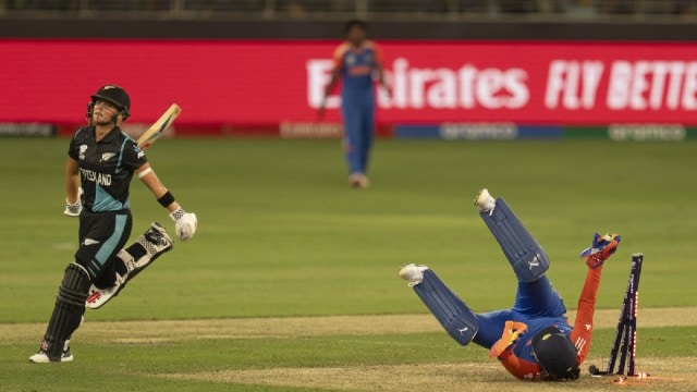 India's wicketkeeper Richa Ghosh, right, unsuccessfully tries to run out New Zealand's Amelia Kerr during the ICC Women's T20 World Cup 2024 match between India and New Zealand at Dubai International Stadium, United Arab Emirates,