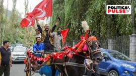 Jammu and Kashmir National Conference (JKNC) supporters celebrate as the party leads amid the counting of votes for the Jammu and Kashmir Assembly elections, in Srinaga