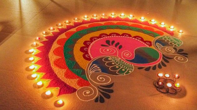 Drawing rangoli patterns is believed to invite positive energy into the home, making it an essential part of the Diwali festivities. (Source: Canva)