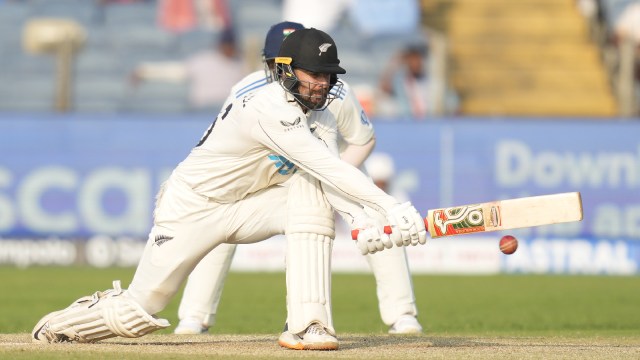 New Zealand's Tom Blundell plays a shot during the day two of the second cricket test match between India and New Zealand at the Maharashtra Cricket Association Stadium , in Pune, India