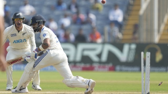 Virat Kohli is bowled during day two of the second cricket Test between India and New Zealand at the Maharashtra Cricket Association Stadium in Pune on Friday. (AP Photo)