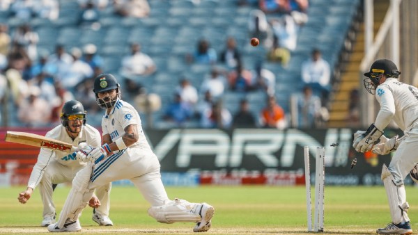 India's Virat Kohli being bowled by New Zealand's Mitchell Santner on the second day of the second test cricket match between India and New Zealand, at the Maharashtra Cricket Association Stadium, in Pune,