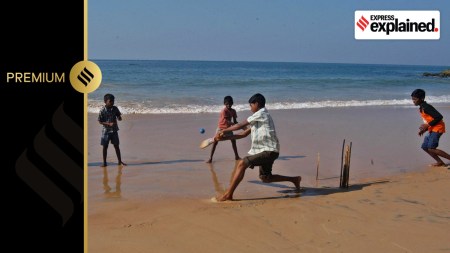 Children playing cricket at a beach in Tamil Nadu.