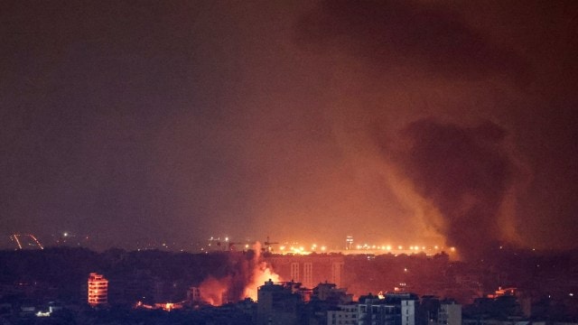 Smoke billows over Beirut's southern suburbs after a strike, amid ongoing hostilities between Hezbollah and Israeli forces