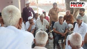 Joginder and Suresh sitting with a group of Jats at Mirchpur in Haryana. (Express Photo by kamleshwar Singh)