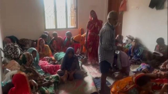 Evacuees gathered at a shelter near Dhamra, Odisha, in anticipation of cyclone Dana. (Video screengrab/ Express)