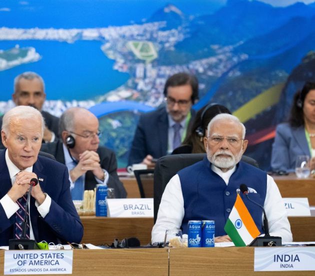 President Joe Biden, left, speaks as Indian Prime Minister Narendra Modi looks on, during the second day of the G20 Summit at the Museum of Modern Art in Rio De Janeiro, Brazil,
