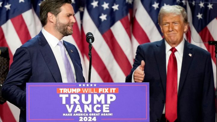 Republican presidential nominee former President Donald Trump gives a thumbs-up as Republican vice presidential nominee Sen. JD Vance, R-Ohio, speaks at an election night watch party