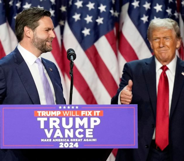 Republican presidential nominee former President Donald Trump gives a thumbs-up as Republican vice presidential nominee Sen. JD Vance, R-Ohio, speaks at an election night watch party