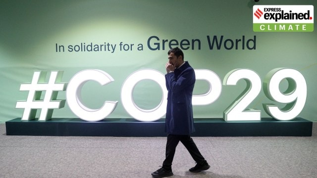 cop29A man walks past an installation with the logo at the venue of the United Nations climate change conference, known as COP29, during a media tour ahead of the summit beginning in Baku, Azerbaijan November 8, 2024.