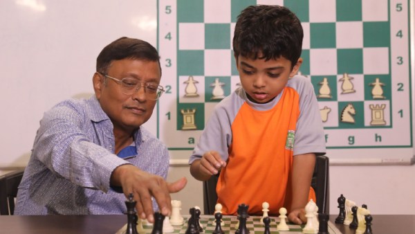 Anish Sarkar with his coach Dibyendu Barua. (Express Photo by Partha Paul)