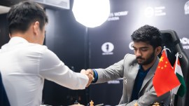 Gukesh Dommaraju and world champion Ding Liren agree to a draw in Game 5 of the FIDE World Chess Championship in Singapore on Saturday. (Photo Credit: FIDE Flickr/Eng Chin An)