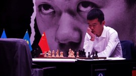Ding Liren contemplates his next move during a World Chess Championship game against Ian Nepomniachtchi last year in Astana. (Screengrab via FIDE YouTube)