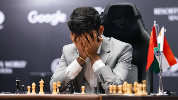 Gukesh reacts aft  realising that a resignation is inevitable successful  the archetypal  crippled  of the World Chess Championship against Ding Liren. (Photo FIDE Flickr via Eng Chin An)