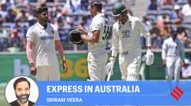 India's Harshit Rana, left, speaks to Australia's Mitchell Starc after the latter was hit on his helmet by a ball from him on the second day of the first cricket test between Australia and India in Perth, Australia