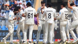 New Zealand players celebrate an India wicket on Sunday in the third IND vs NZ Test at the Wankhede Stadium. Express Photo by Amit Chakravarty