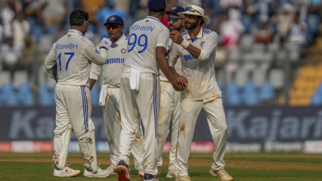 India's Ravindra Jadeja celebrates with teammates at the end of an innings during the first day of the third cricket test match between India and New Zealand at Wankhede Stadium, in Mumbai, India, Friday, Nov. 1, 2024.(AP Photo)