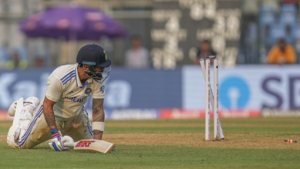 India's Virat Kohli dives successful  vain to forestall  being tally  retired  by New Zealand's Matt Henry during the archetypal  time  of the 3rd  Test astatine  Wankhede Stadium, successful  Mumbai. (AP Photo)