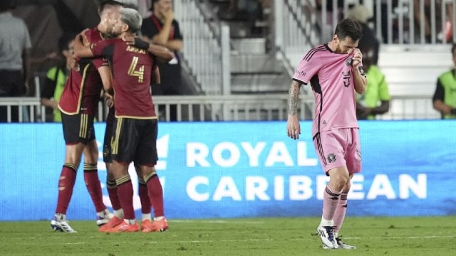 Atlanta United players celebrate as Inter Miami forward Lionel Messi (10) leaves the pitch at the end of their MLS playoff opening round soccer match, Saturday, Nov. 9, 2024, in Fort Lauderdale. (AP Photo)