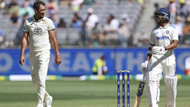 Australia's Mitchell Starc (left) and India's Yashasvi Jaiswal smile as they have a chat on the second day of the first cricket test between Australia and India in Perth, Australia, Saturday. (AP)