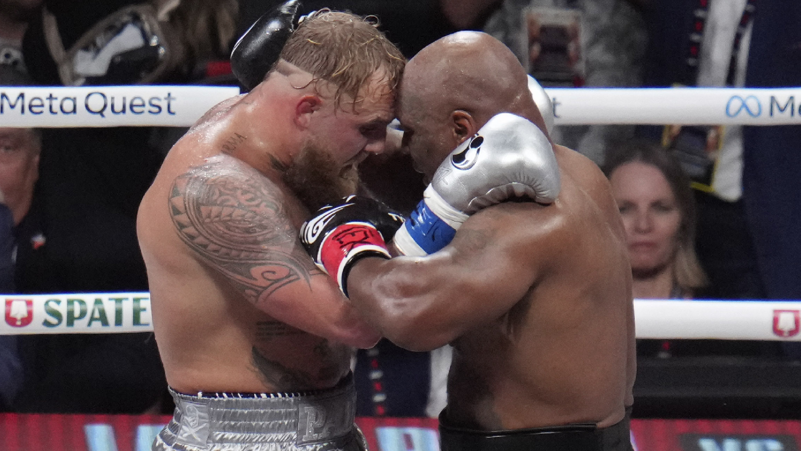 Jake Paul and Mike Tyson embrace after their heavyweight boxing match in Arlington, Texas. (AP Photo/Julio Cortez)